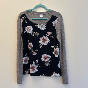 Soft top. Black with flowers and gray sleeves and back.  Very cute! Size S